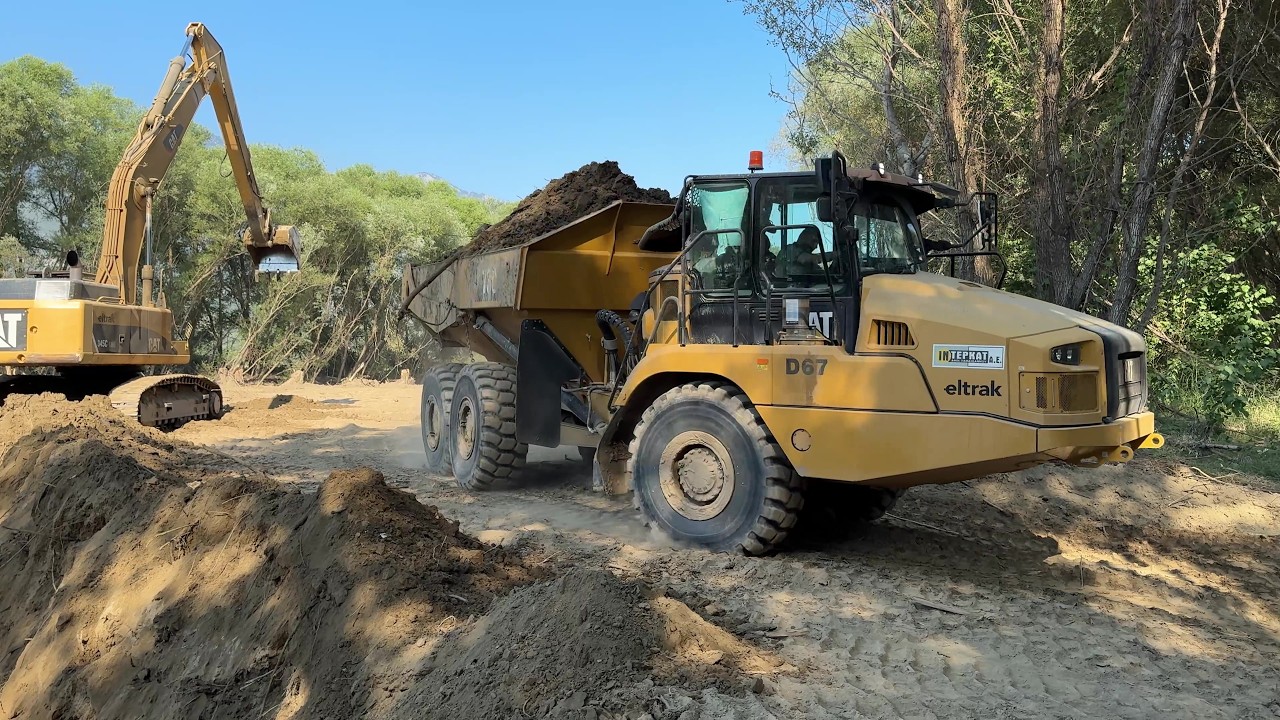Riverbed Construction : CAT 345C Long Reach Excavator Loads Articulated Trucks - Interkat SA