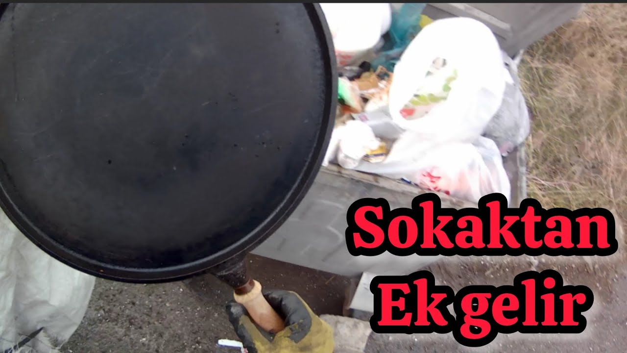 KAGIT TOPLAYICISININ BOŞ TENEKELERLE MÜCADELESİ 