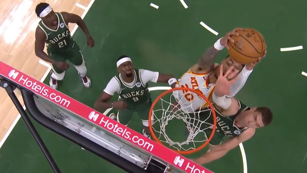 Trae Young tosses it off the glass to John Collins for the slam! Bucks vs Hawks Game 1