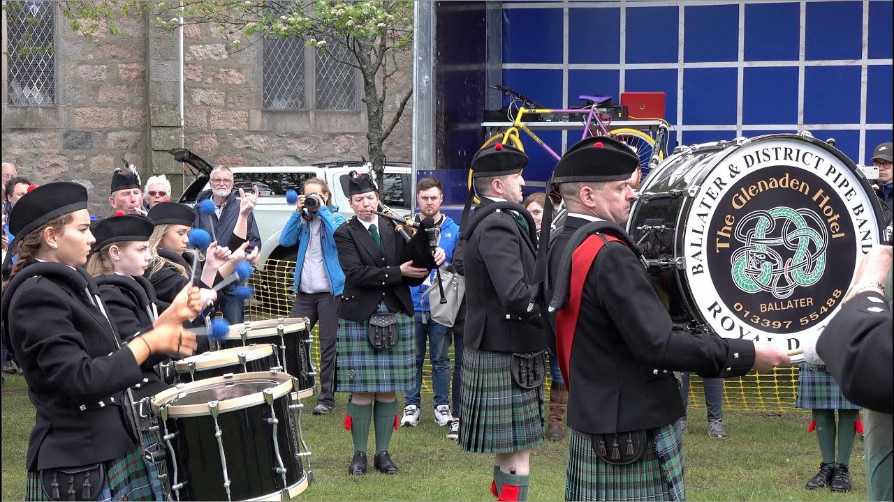 Ballater Pipe Band Playing 2/4 time marches on the green during the 2019 Ballater Duck Festival