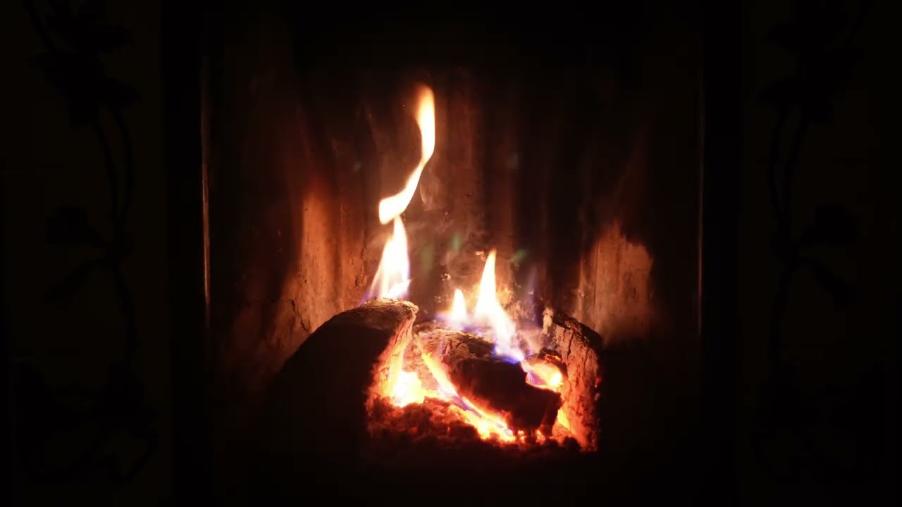 4k Fireplace Ambience - dark hearth with a warm glow and gentle crackling