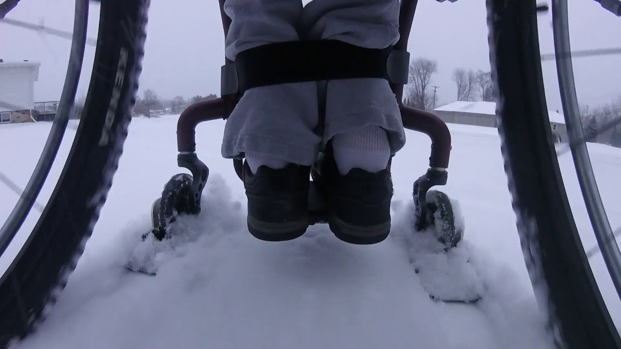 Wheelchair in the snow with WheelBlades.