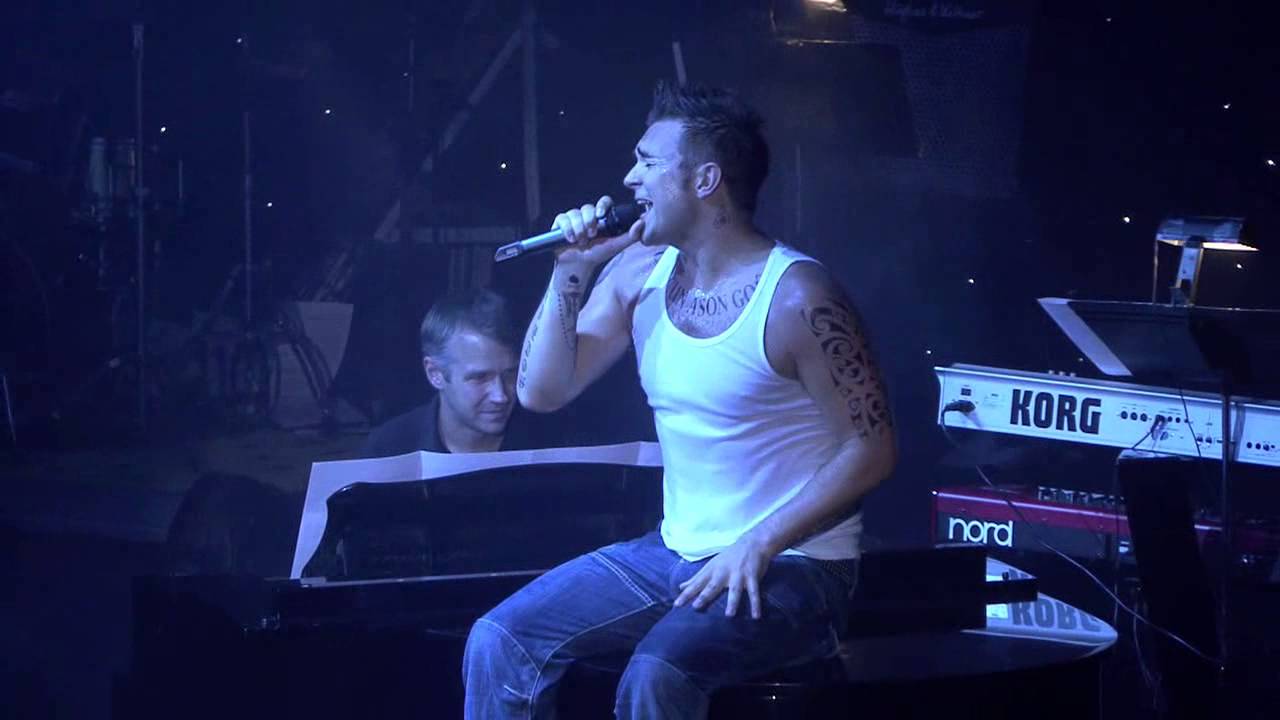 Tony Lewis As Robbie Williams
