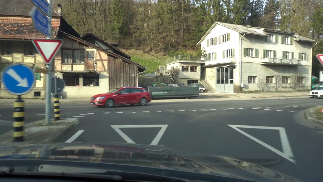 Driving from Mittelhäusern to Düdingen via an old traditional wooden bridge, Switzerland in 4K