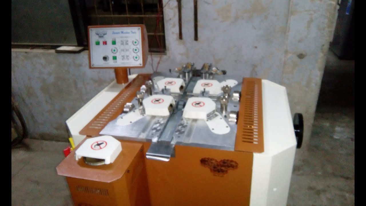 S.M.T Four wheel edge grinding and buffing machine.