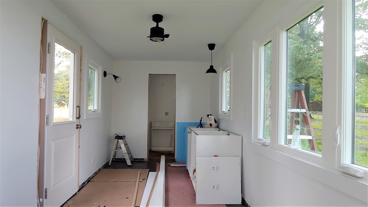 Building Cabinets, Hanging the Pocket Door, etc, in the Container
