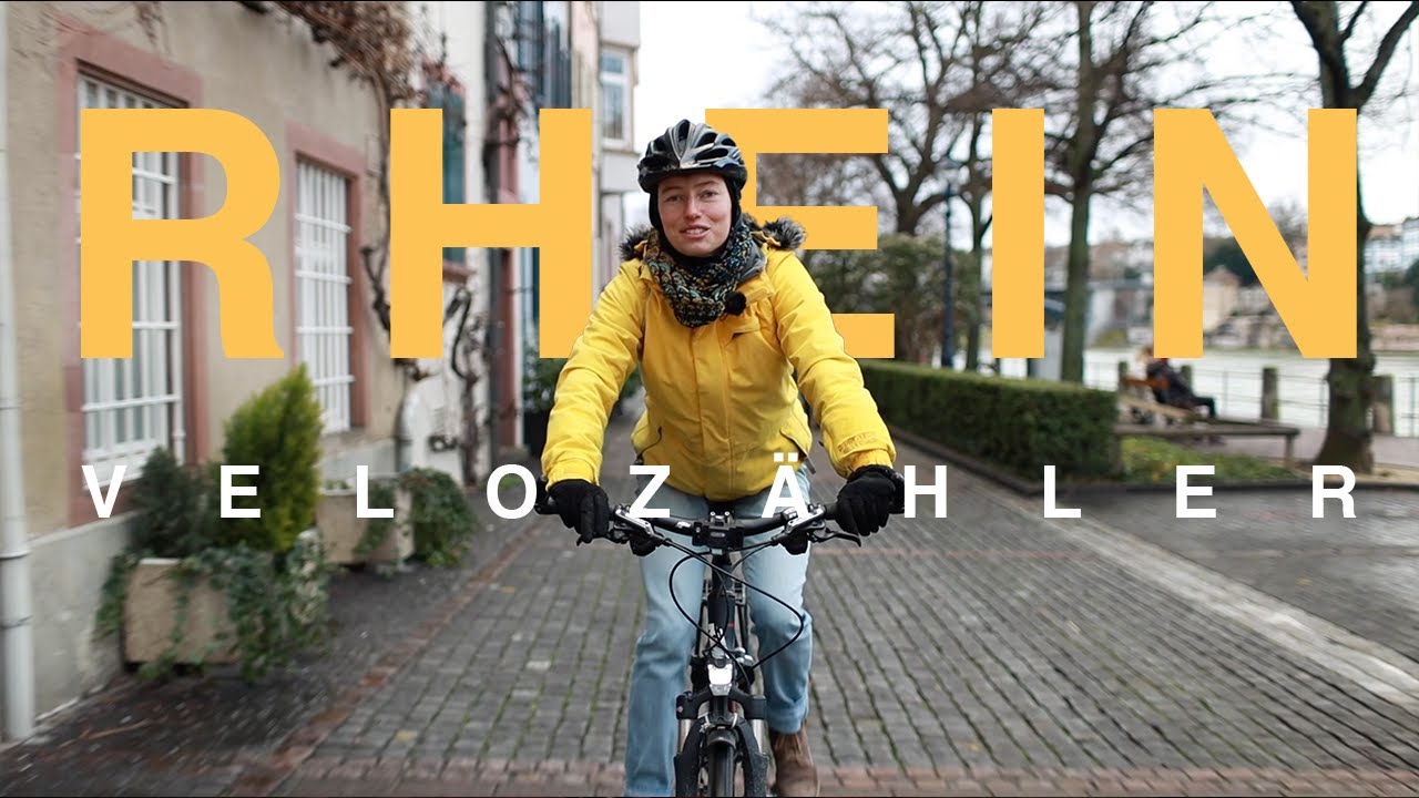 Velofahren am Rhein mitten in Basel