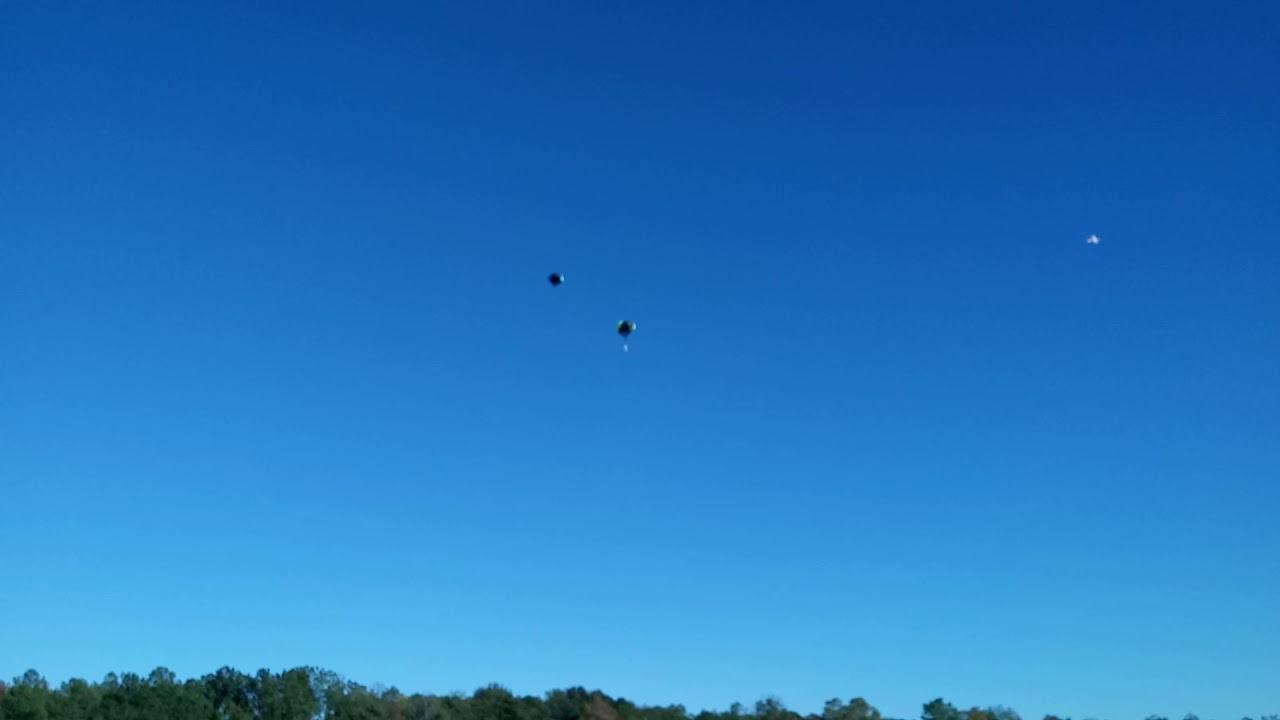 Curtis with his electric C-130 dropping parachuters