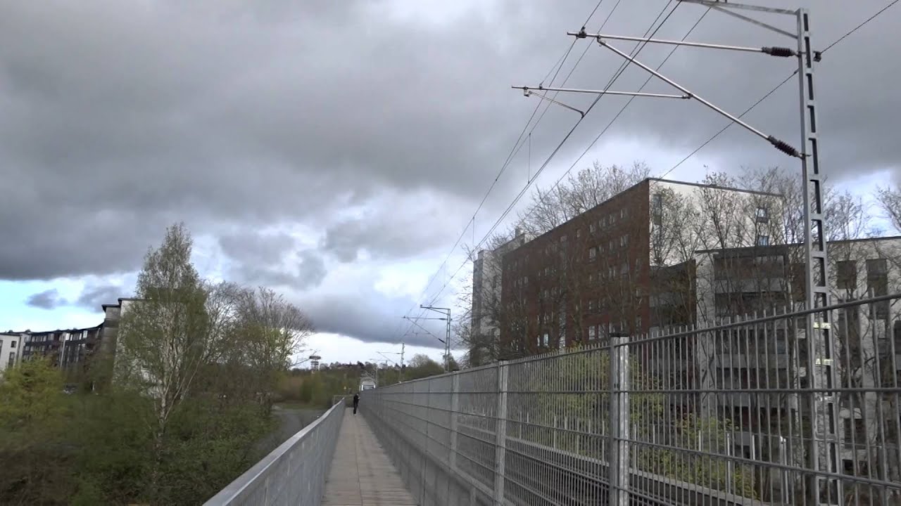 An InterCity2 train from Turku to Helsinki is going past, on the railway bridge, Aura river, Turku