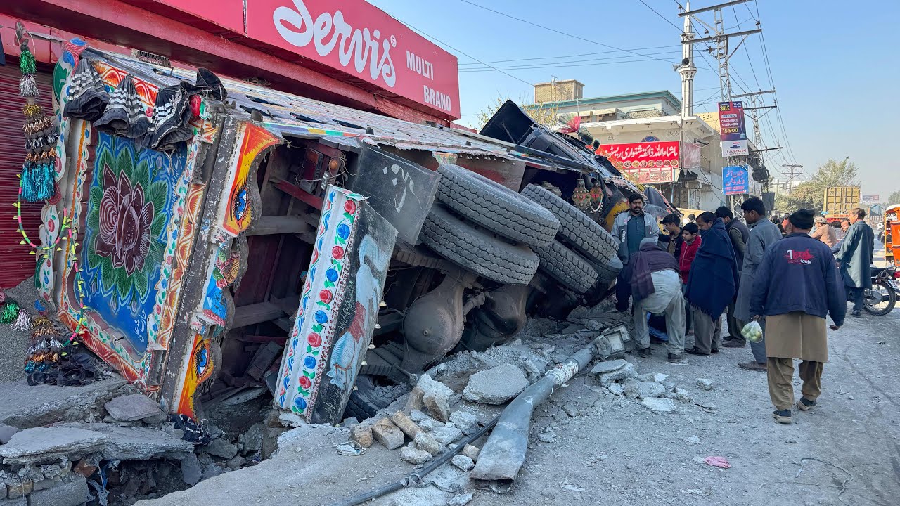 Out of Control! Loaded Truck Flips and Destroys Roadside Shops