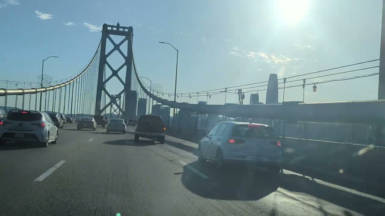 Crossing Bay Bridge. Full Span. Great city view towards end