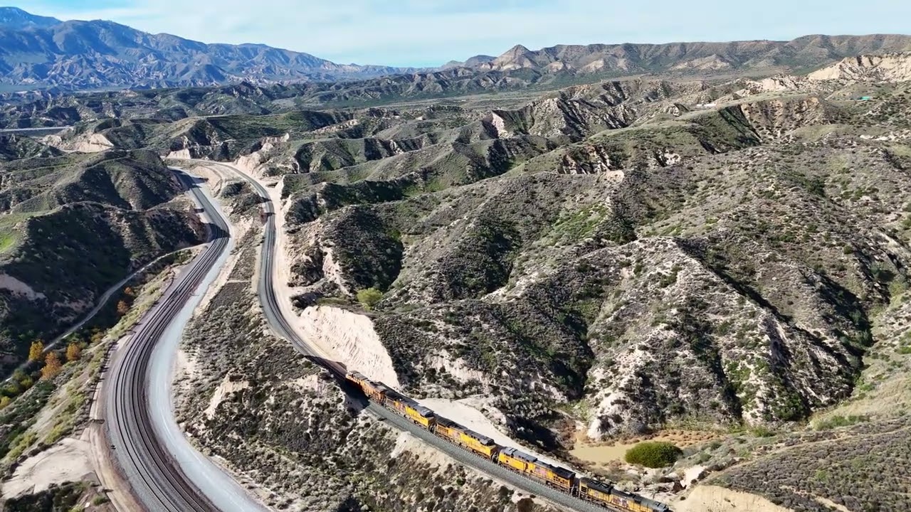 Follow a 7 loco manifest from Cajon Pass Summit, past Hill 582, and on to Mormon Rocks.