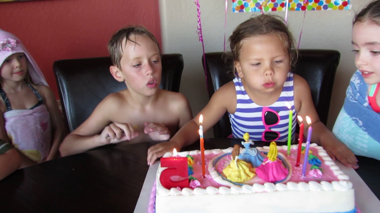 Amelia blowing out the candles