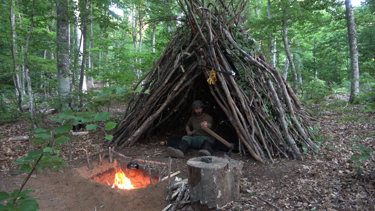 SOLO OVERNIGHT BUSHCRAFT CAMP DEEP IN THE FOREST BUILDING A TIPI SHELTER  AND COOKING OVER THE FIRE
