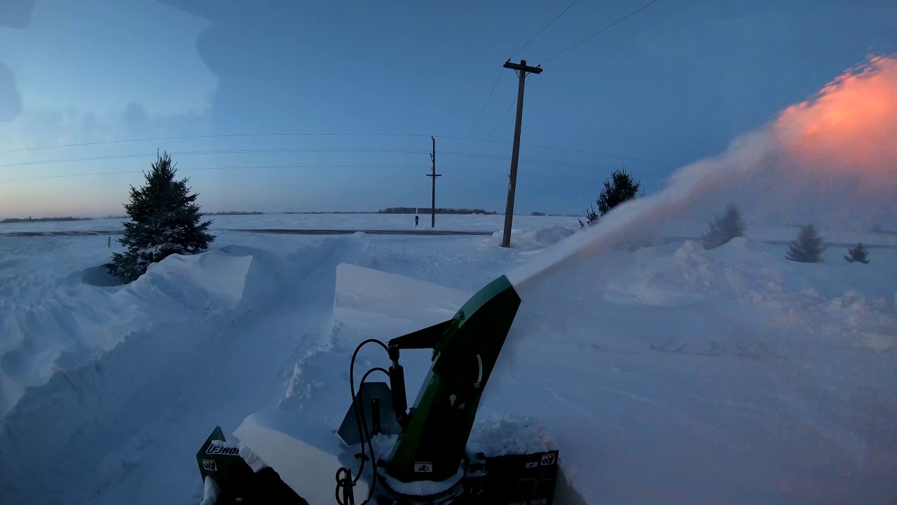 John Deere 4066R with Frontier SB1174 Blowing Compacted Drifts