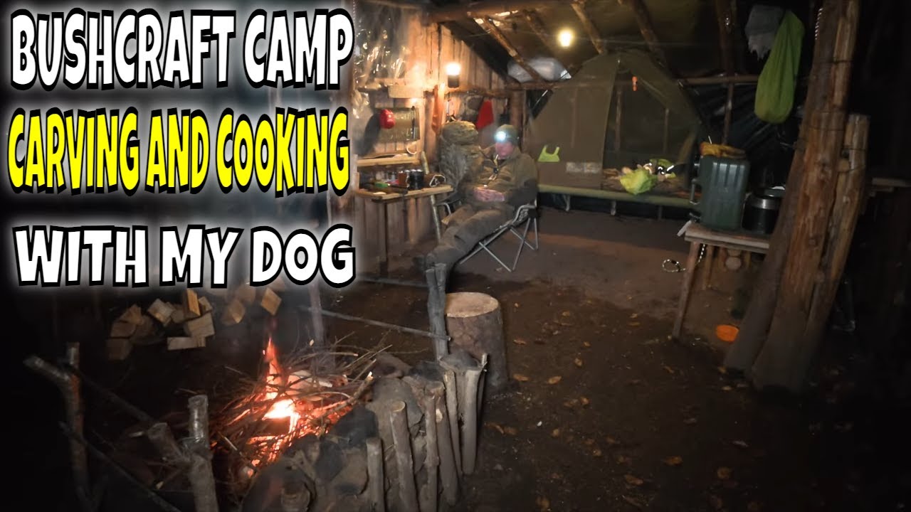 bushcraft camp carving and cooking food with my dog