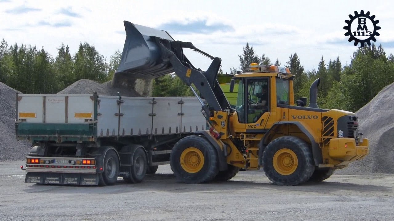 Volvo L90F loading gravel on trucks