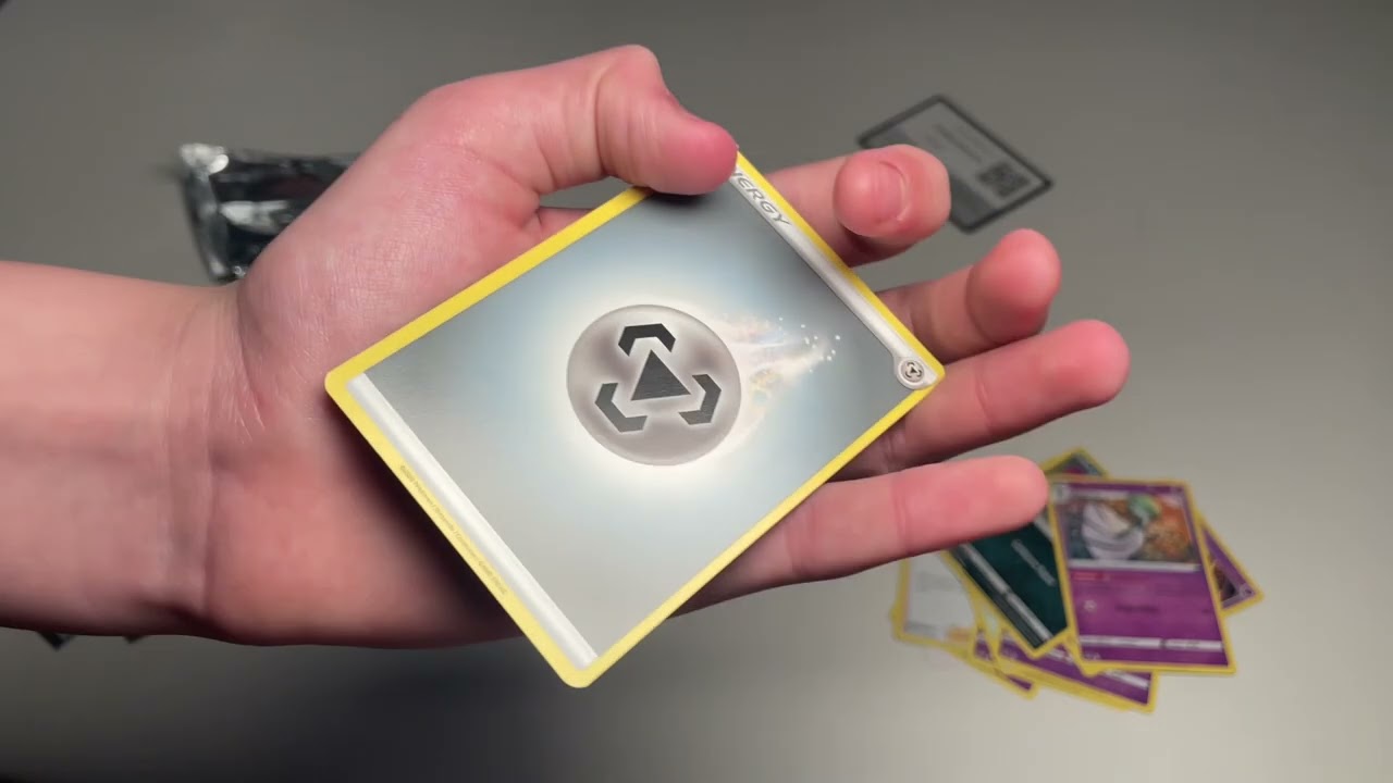 Opening Pok&eacute;mon trade card game tin box and one extra pack.