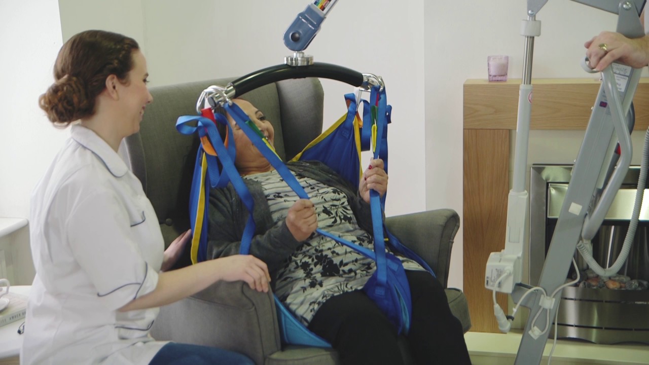Transfer from chair to shower chair featuring Freeway S 160 Mobile Hoist