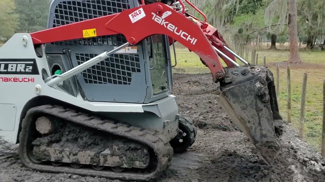 Takeuchi TL8R2 compact track loader grading