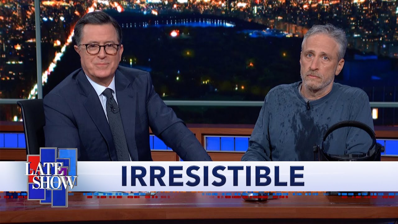 Jon Stewart Climbs Out From Under Colbert's Desk To Debut 
