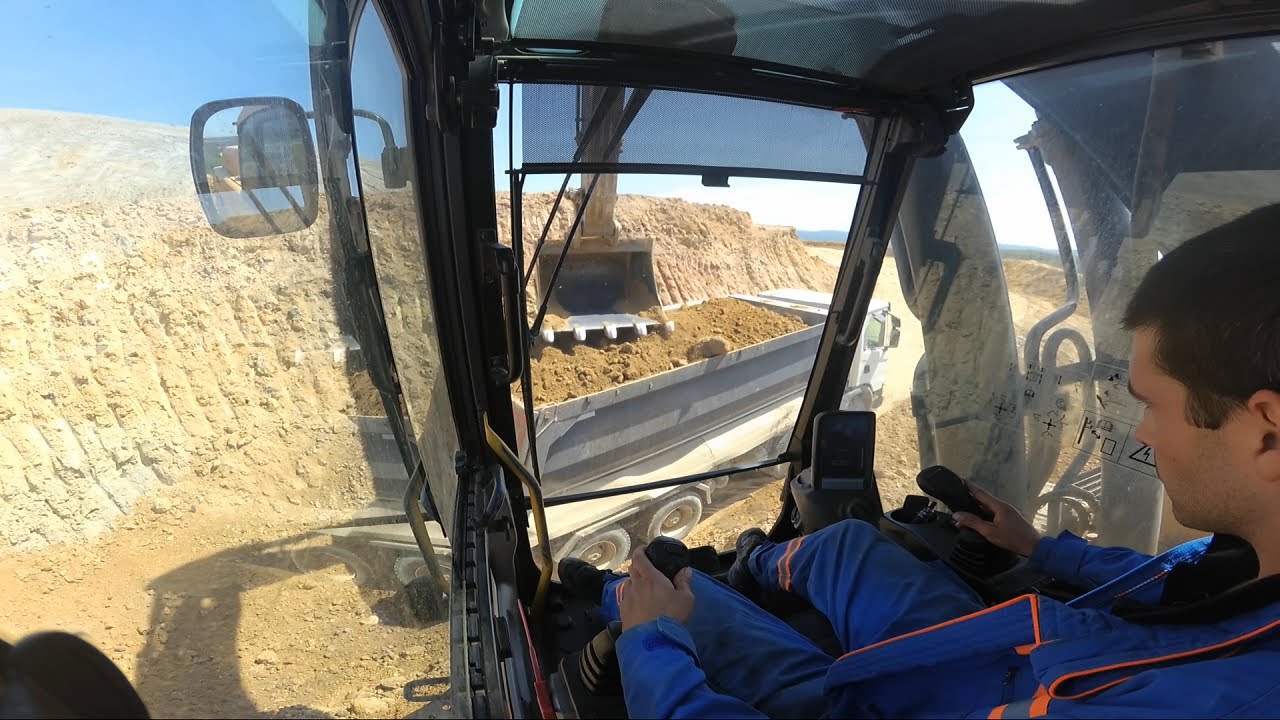 Excavator Volvo EC380D loads trucks #9