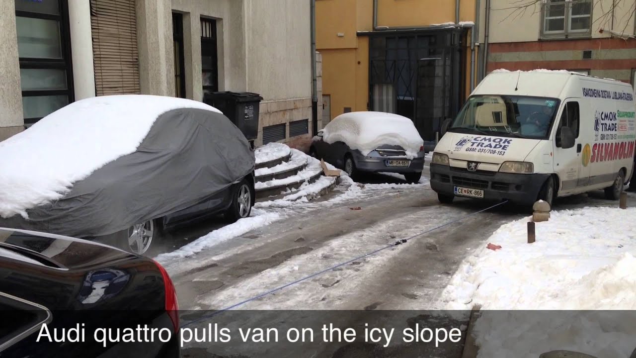Audi A6 pulls van on the icy slope