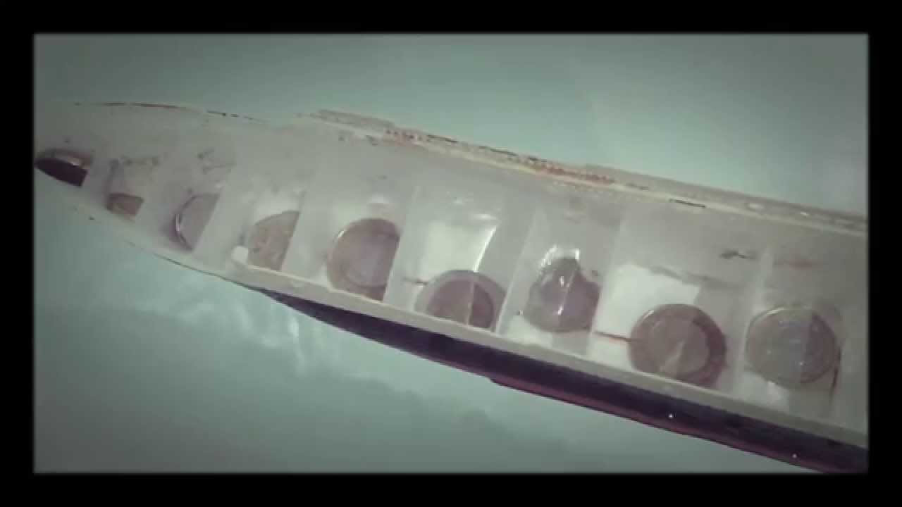 Model Titanic with 16 watertight compartments sinks in a bathtub