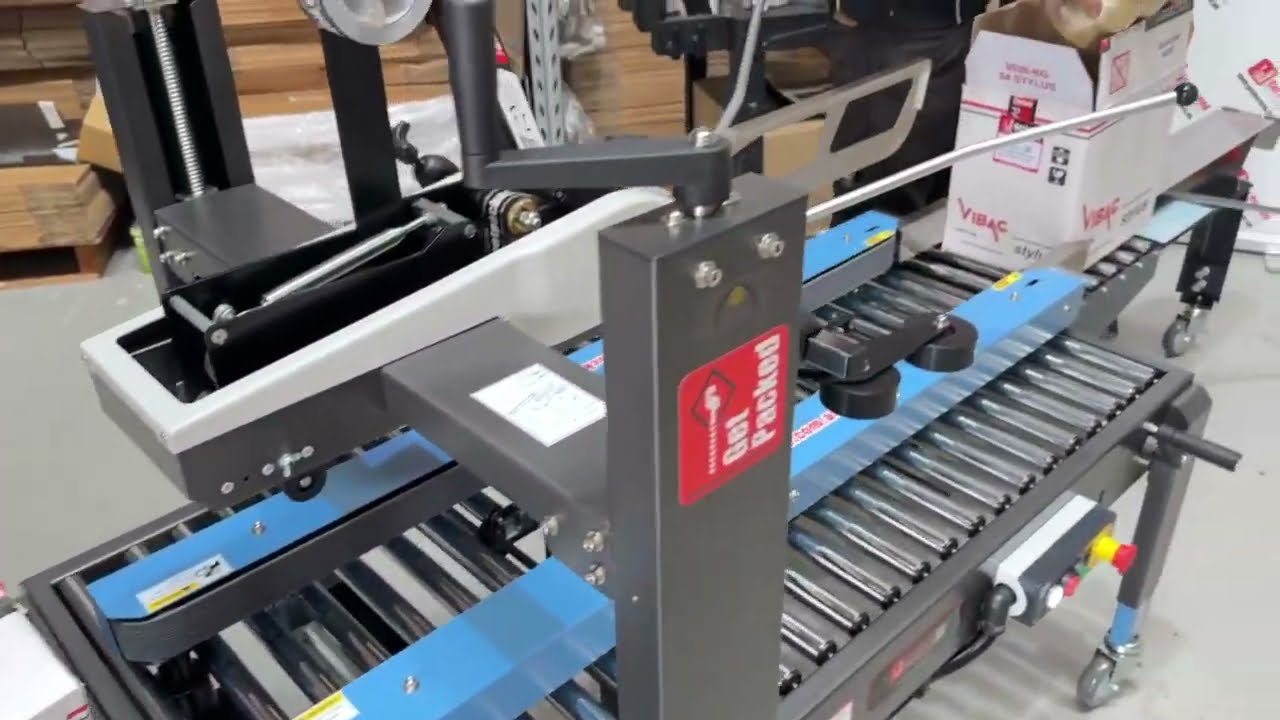 Box Taping Machine with Carton Former Infeed conveyor.
