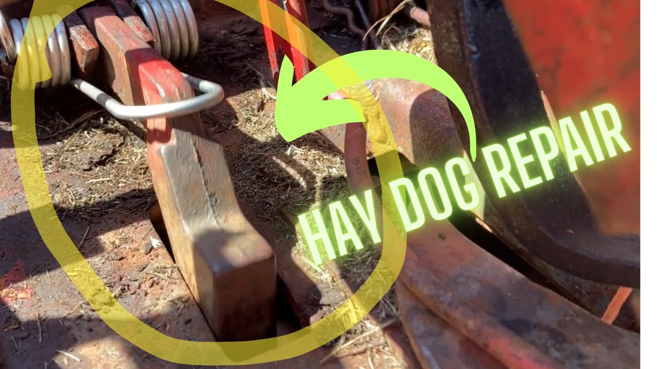 Hay dog repair on a New Holland baler