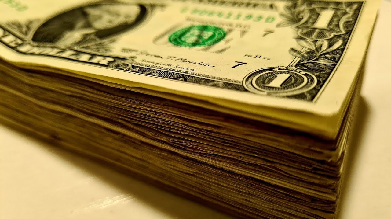 100 US Dollars in 1 $ bills. Counting 100 dollars