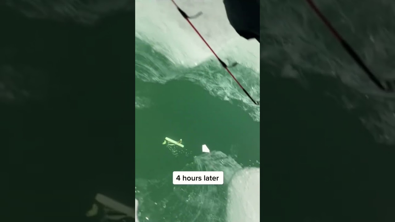 Man Carefully Reels in Phone After Dropping it Whilst Ice Fishing