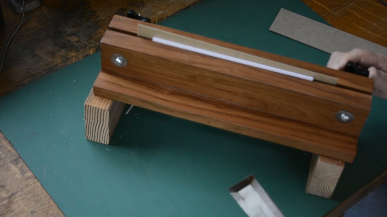 Using an inexpensive finishing press and a chisel to trim a text block