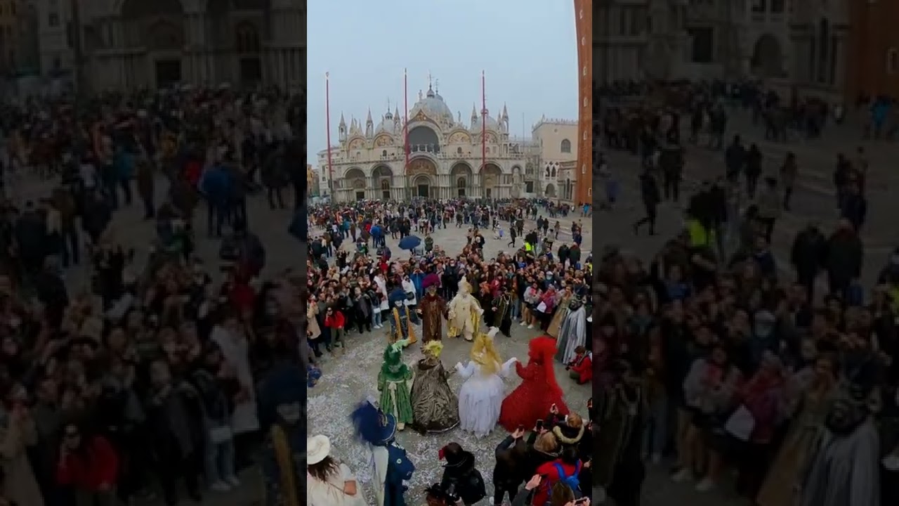 Dancing masks at San Marco square during Venetian carnival