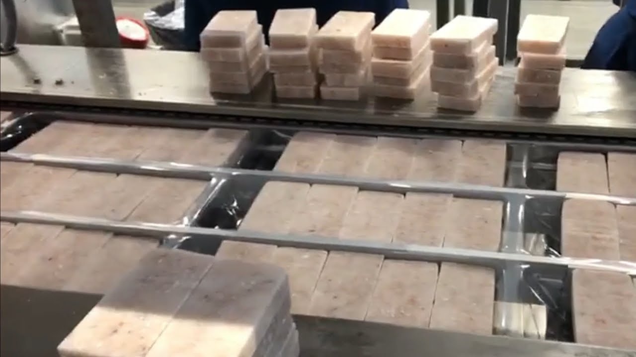 COLIMATIC Thermoforming THERA650 for frozen fish blocks in vacuum packaging