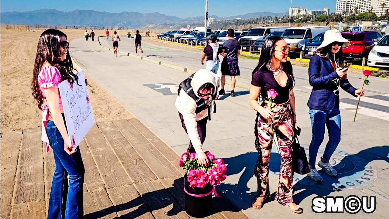 𝗩𝗔𝗟𝗘𝗡𝗧𝗜𝗡𝗘 𝗠𝗢𝗠𝗘𝗡𝗧: Woman Hands Out Free Roses Along Santa Monica Beach