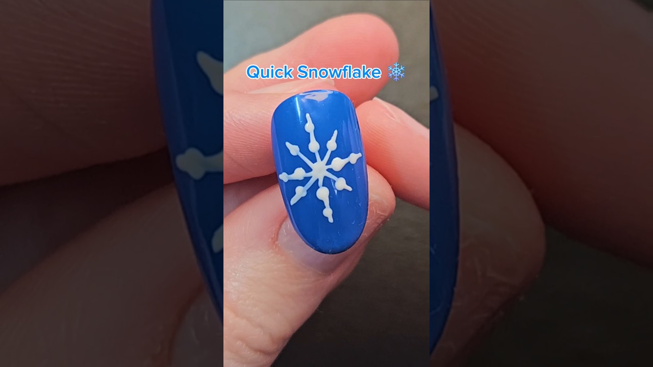Quick and easy snowflake nail art tutorial. ❄️ #nails #snowflakenails #christmasnails