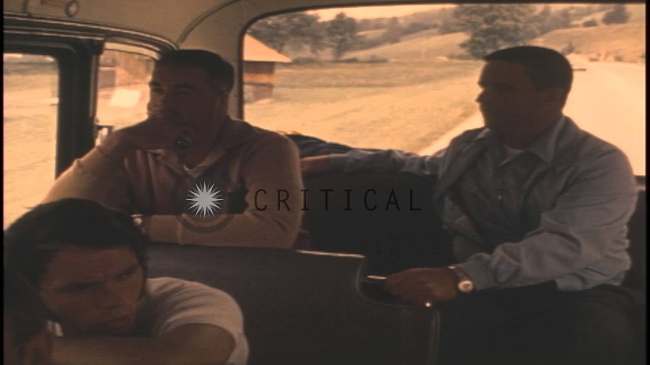 A bus carrying CISM (International Military Sports Council) delegates drives past...HD Stock Footage