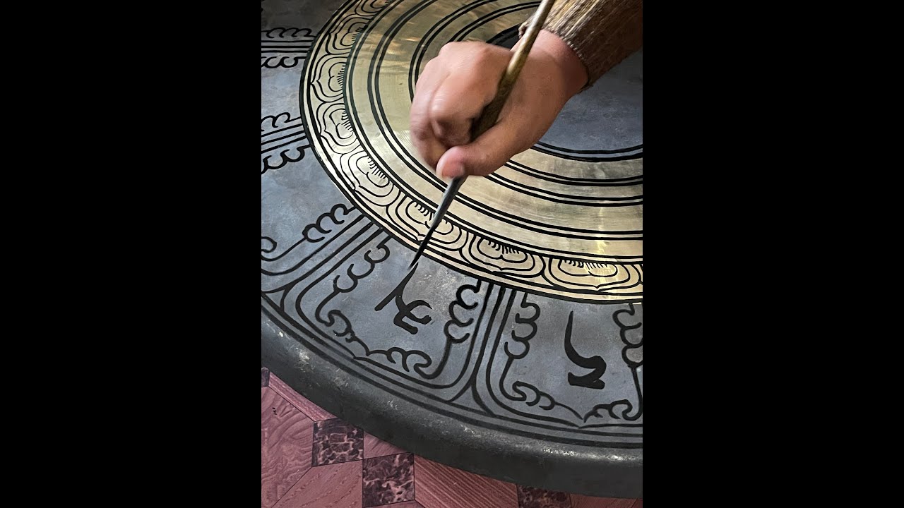 The Original Singing Gongs - the design artist at work.