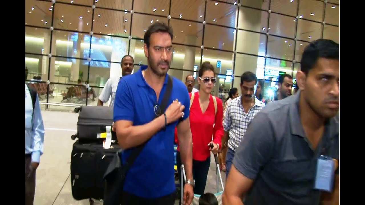 Ajay Devgan and Kajol with family at Mumbai Airport returning back from a vacation.