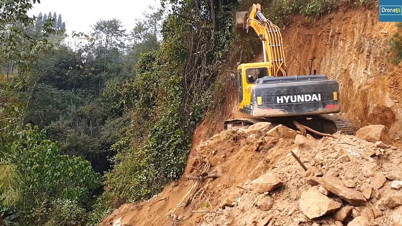 Mountainside excavation for New Mountain Road Track with HYUNDAI Excavator