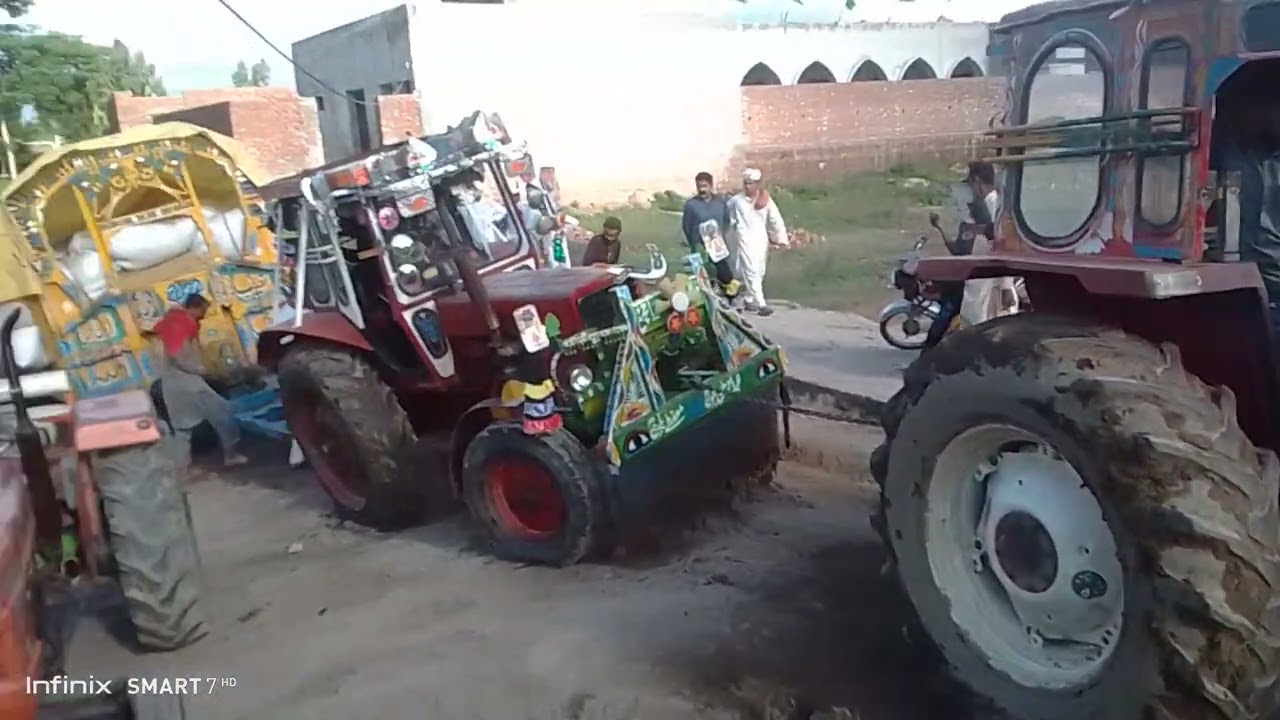 Belarus 510 and Fiat 640 performance with trolley stucked in mud