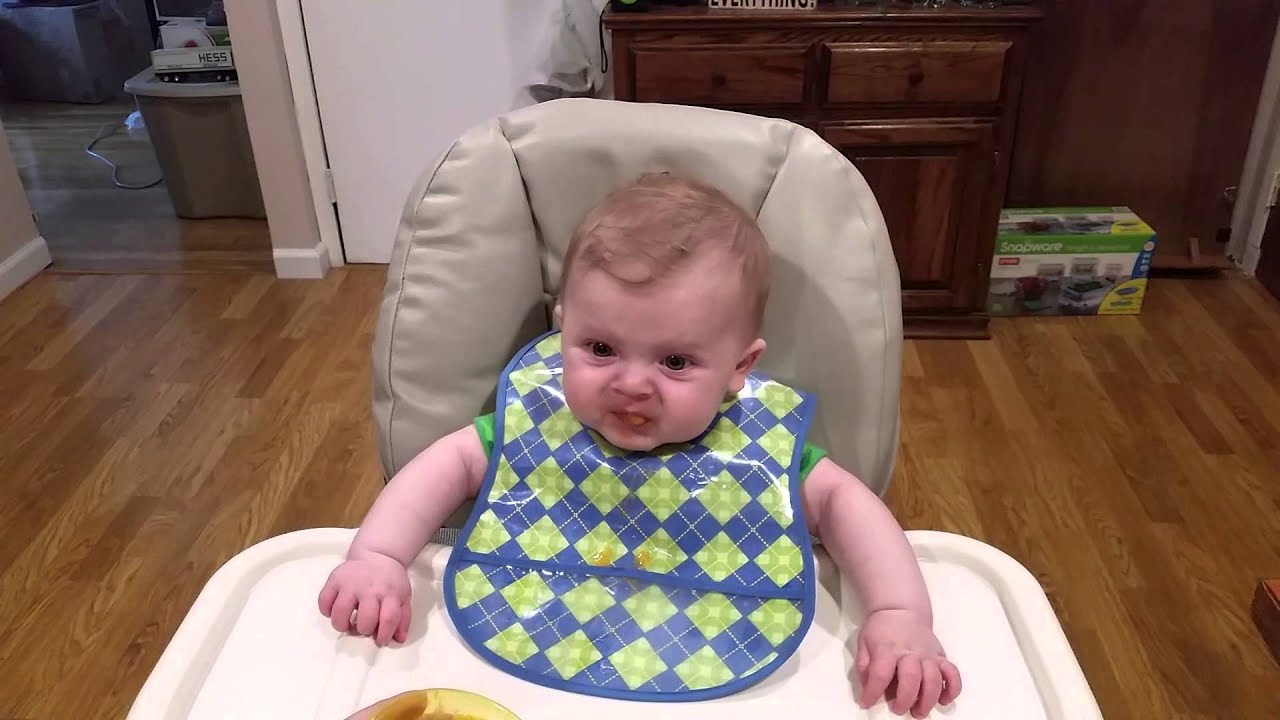 Mikey eating sweet potatoes for the first time