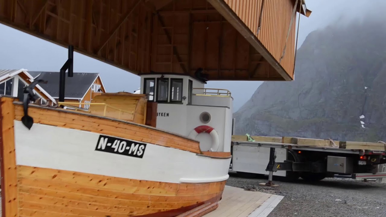 Pøyken -  Unveiling of a historic fishing boat after renovation. Sakrisøy, Lofoten Islands.