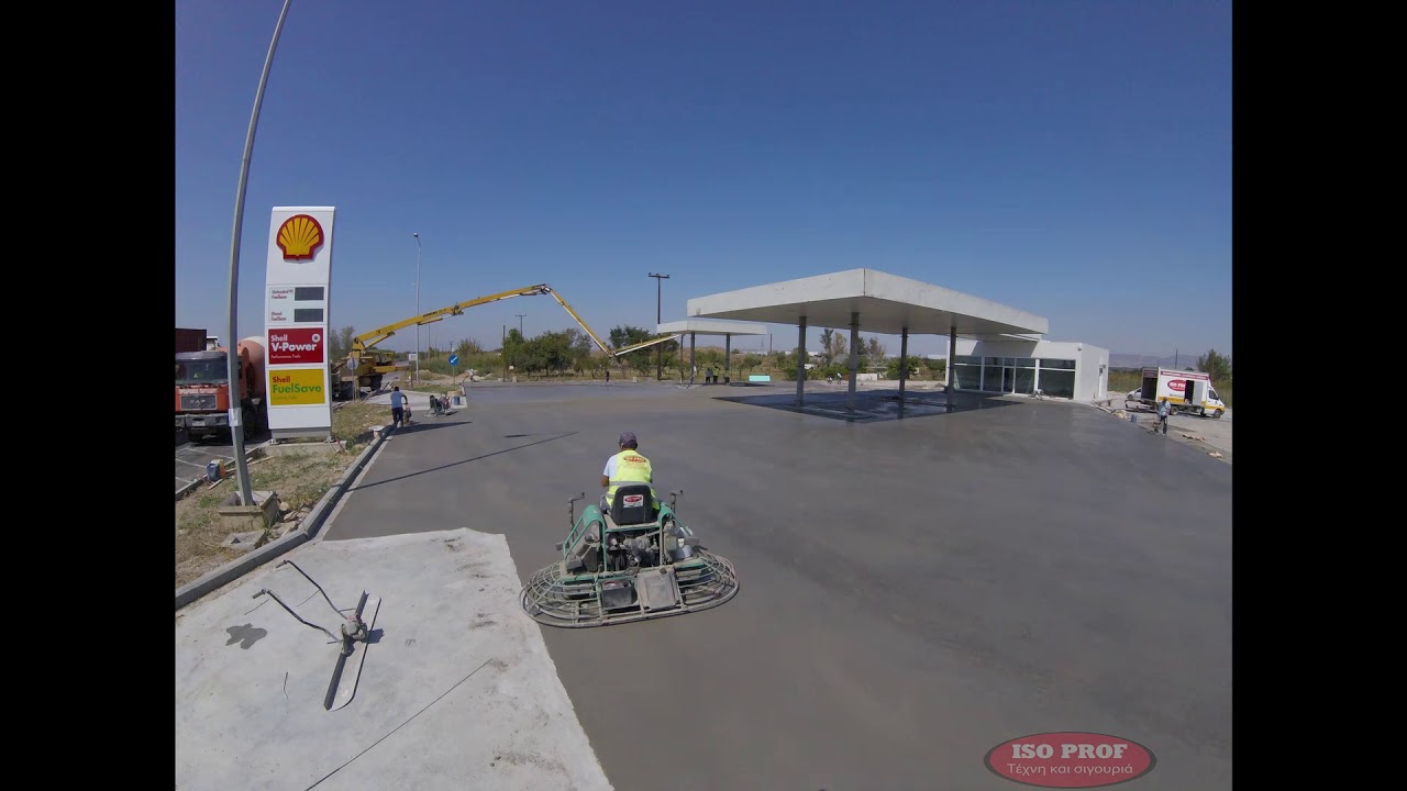 Construction of screed concrete floor at a Shell gas station