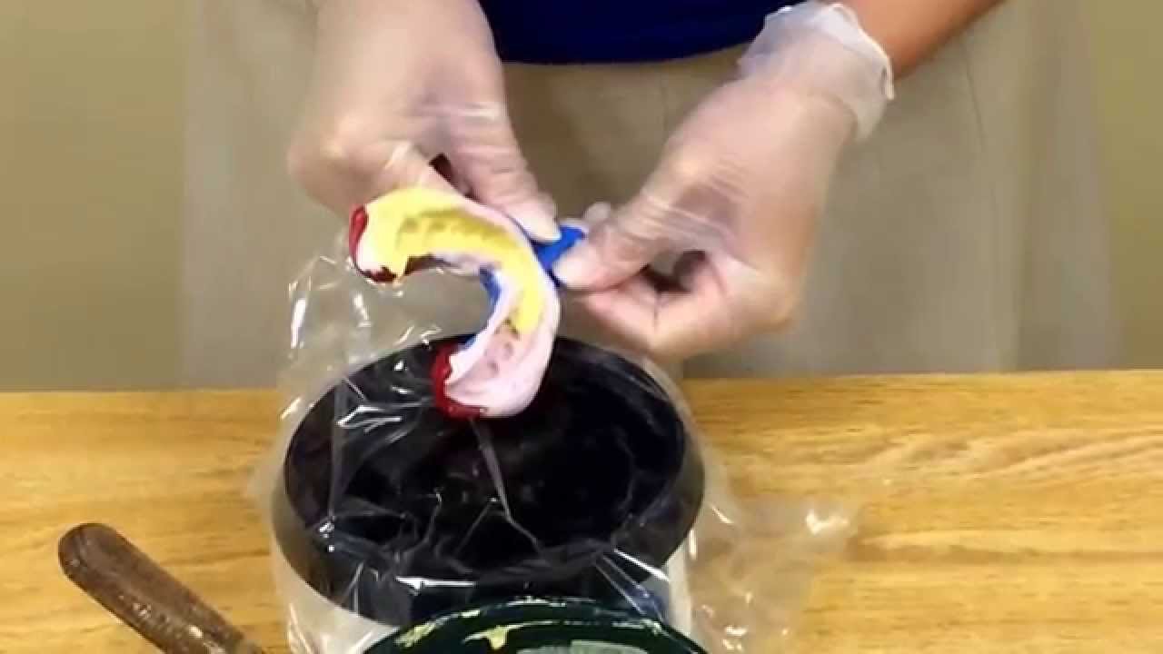 Pouring a mandibular impression.
