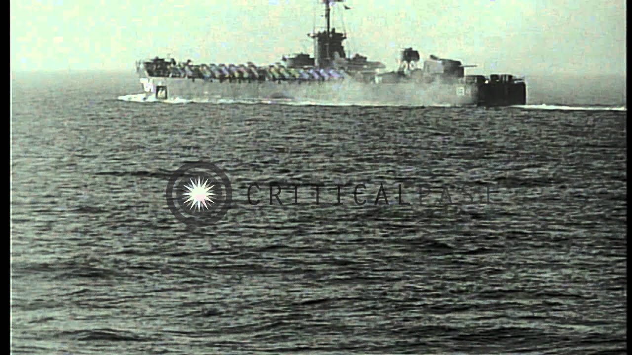 U.S. warships firing and underway during invasion of  Okinawa in World War II HD Stock Footage