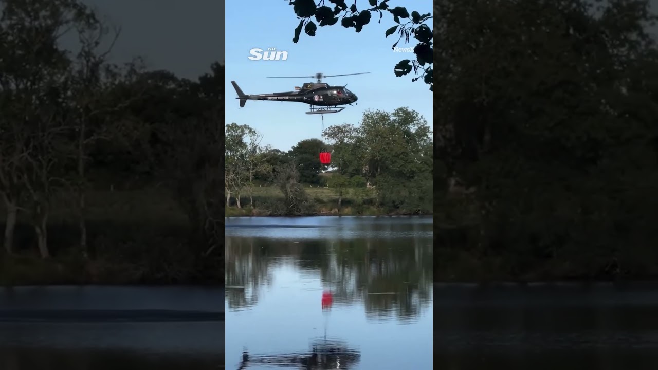 Shocking moment helicopter spins out of control and crashes into lake