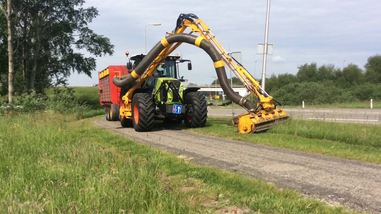 Claas Arion 650 CMATIC  met Herder maai zuigarm