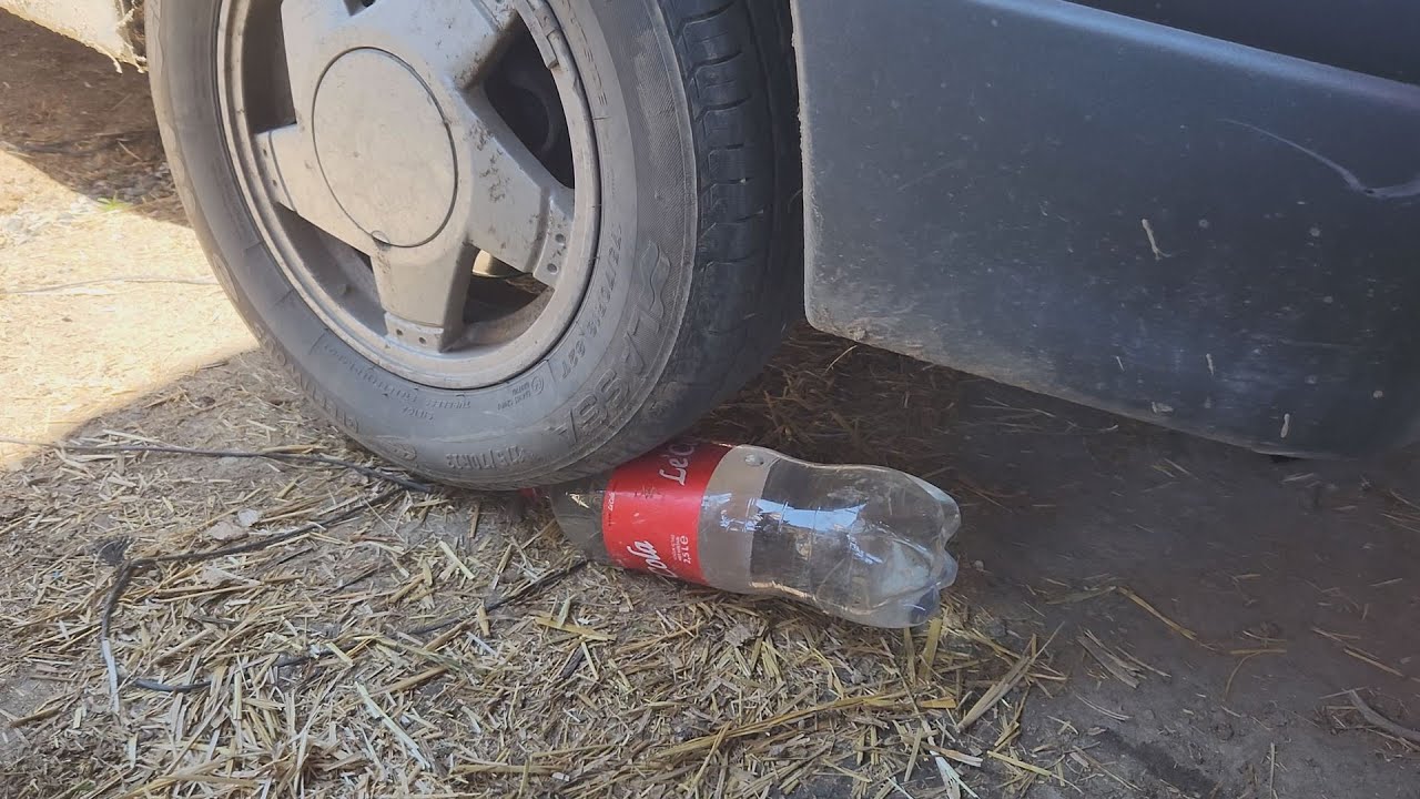 EXPLODING A COLA BOTTLE WITH A CAR TIRE